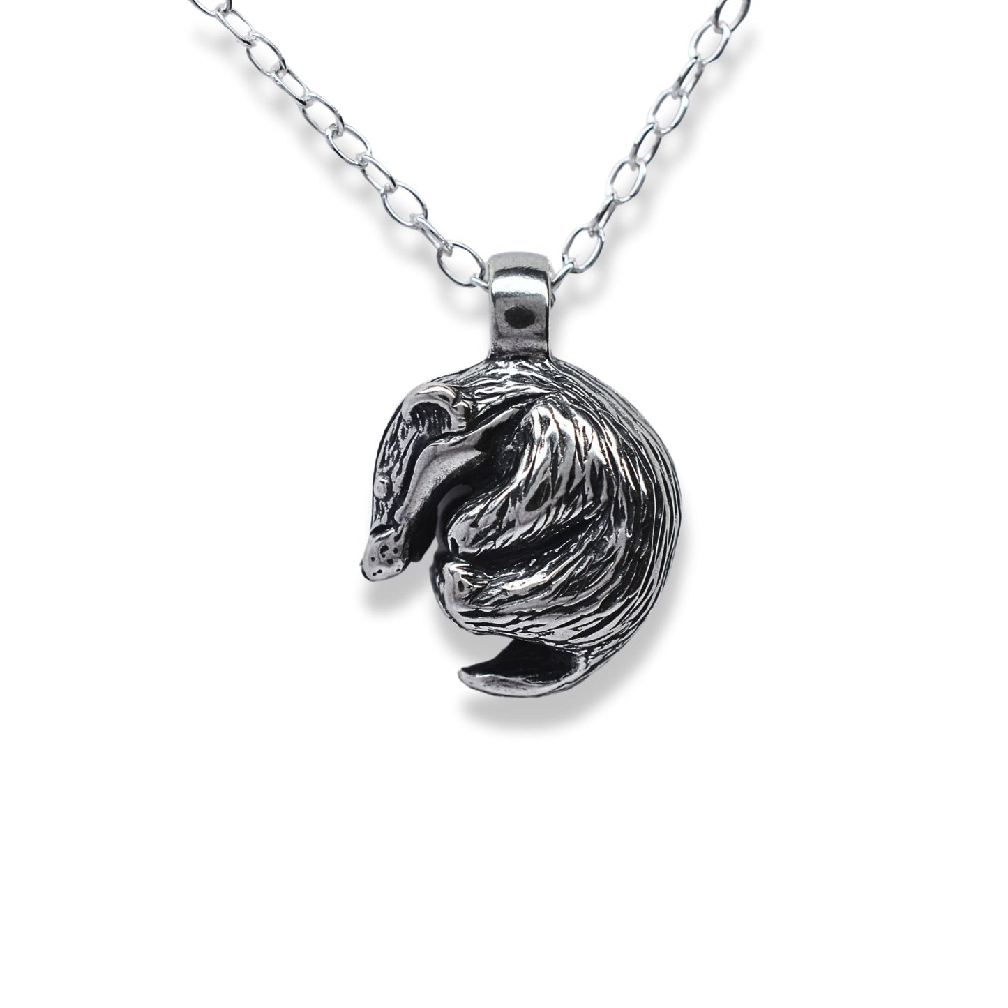 Solid sterling silver badger charm pendant and chain. © Adrian Ashley