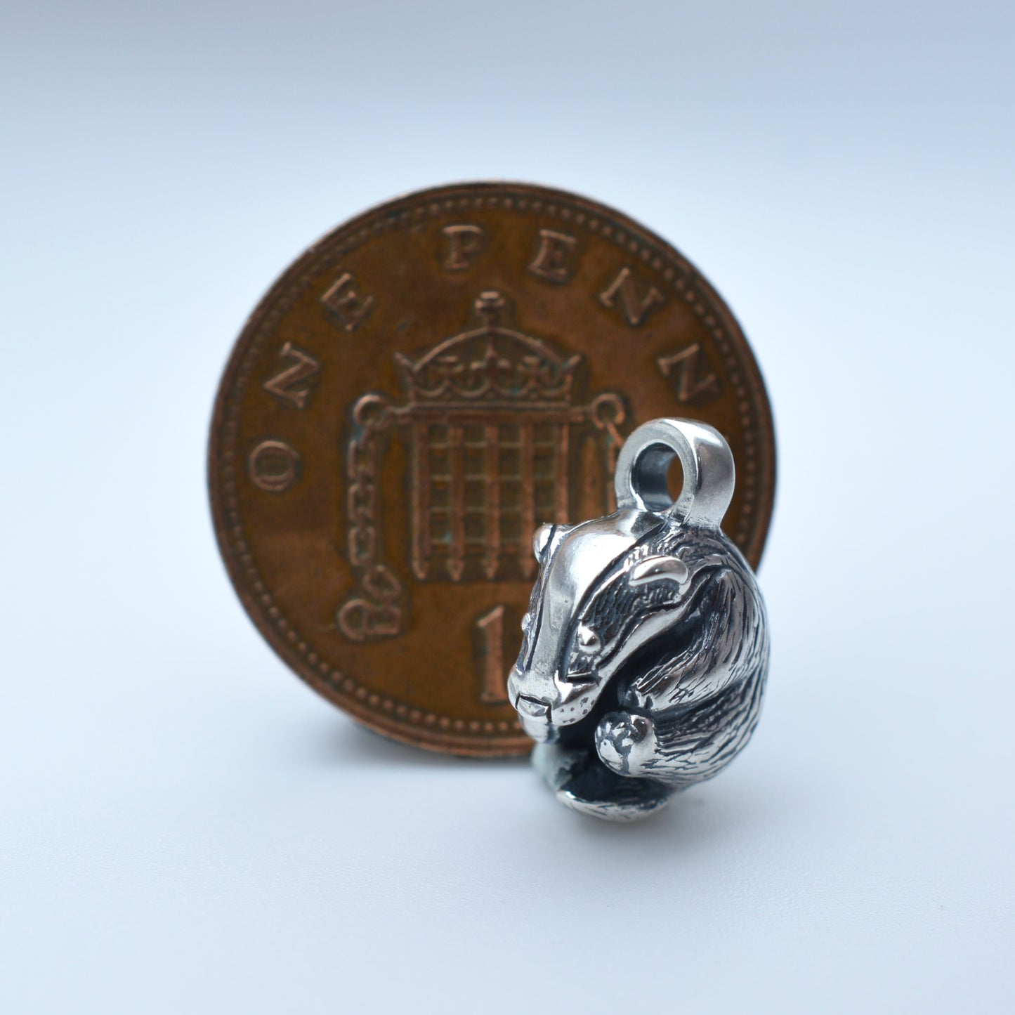 Solid sterling silver badger charm pendant and chain. © Adrian Ashley