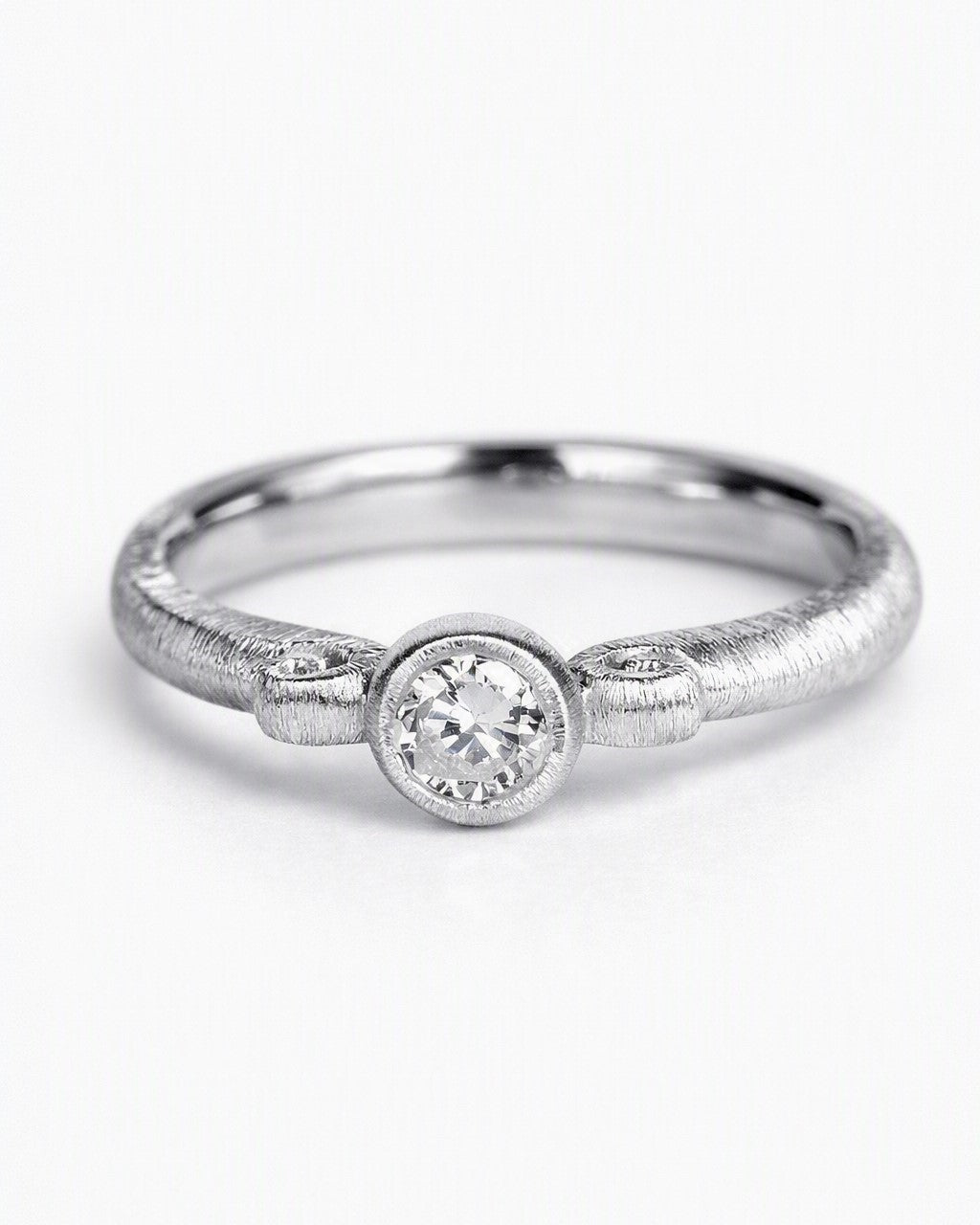 Diamond ring featuring a 0.25ct natural diamond reclaimed from vintage jewellery.