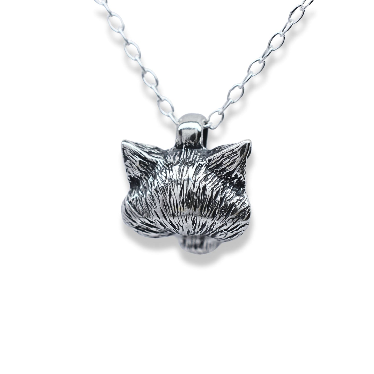 Solid sterling silver wolf pendant and chain. © Adrian Ashley