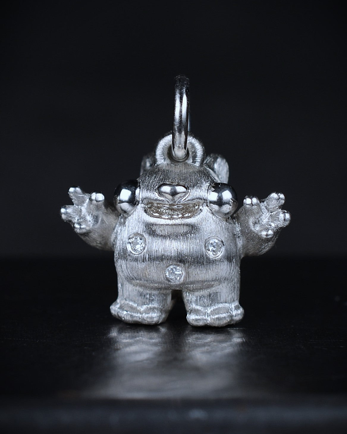Spotty Dumpy Bright Creature set with natural diamonds.