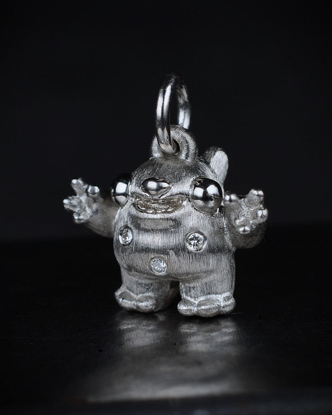 Spotty Dumpy Bright Creature set with natural diamonds.