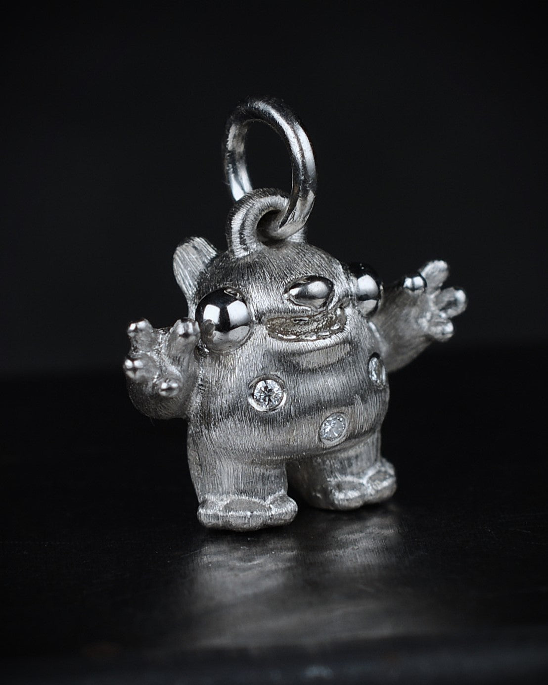 Spotty Dumpy Bright Creature set with natural diamonds.