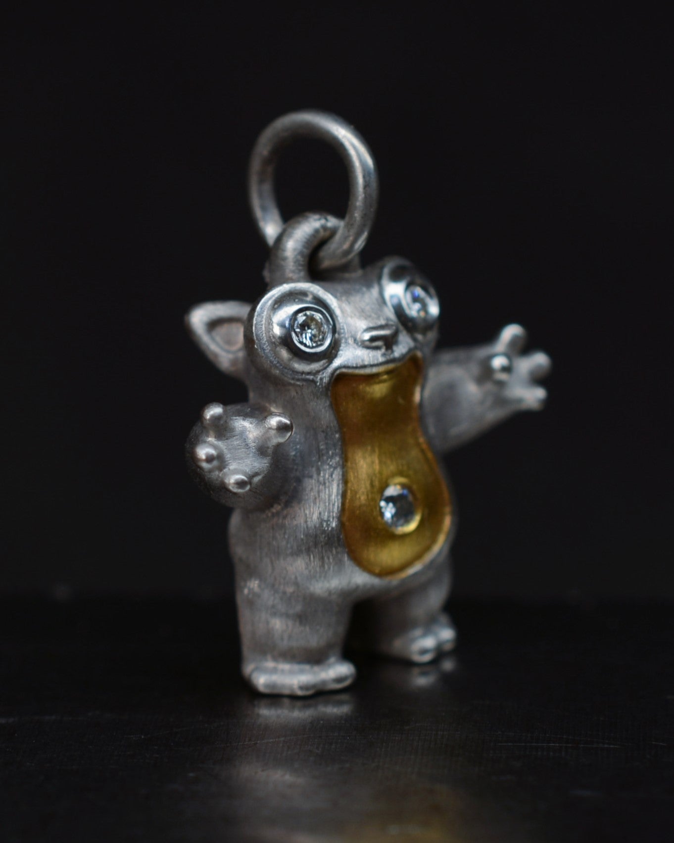 Tarsier Type Bright Creature with a diamond eyes and parcel gilt.