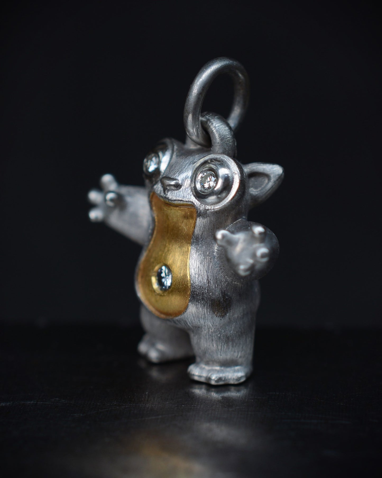 Tarsier Type Bright Creature with a diamond eyes and parcel gilt.