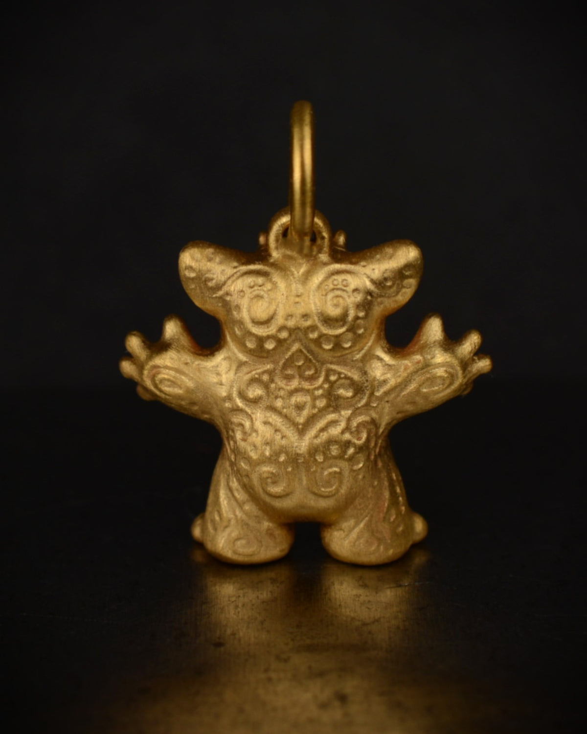 Satin finished vermeil Creature set with a natural diamond.