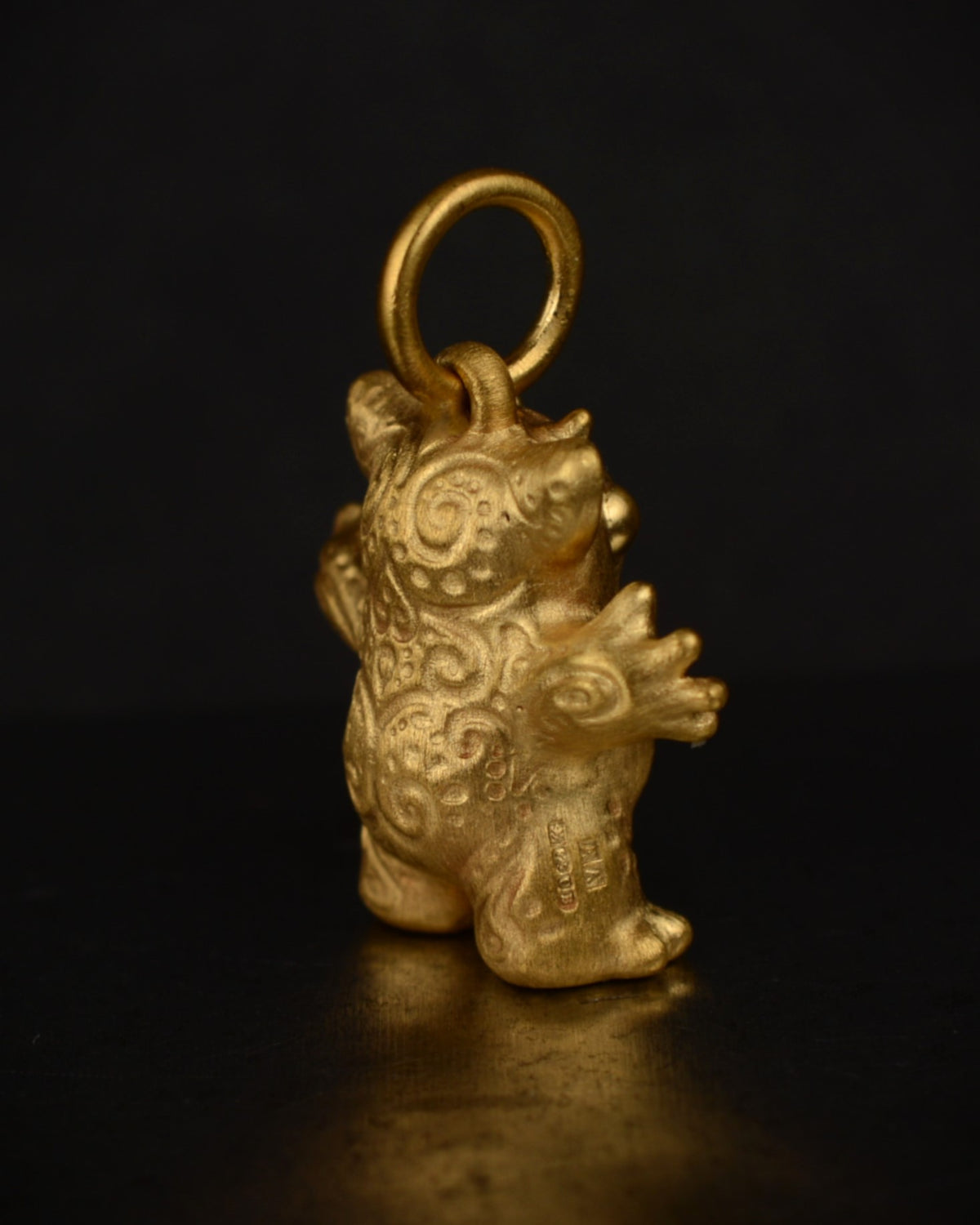 Satin finished vermeil Creature set with a natural diamond.
