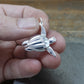 Sea Turtle necklace. Made from highly polished, tarnish resistant silver, hung on a solid silver chain. © Adrian Ashley