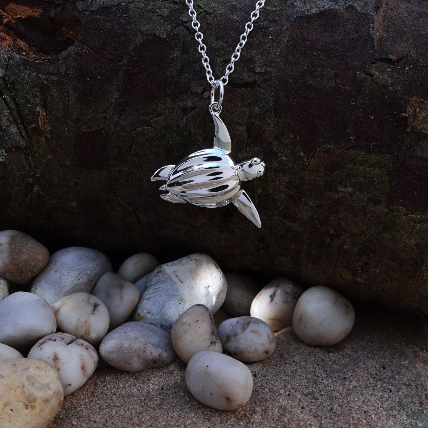 Sea Turtle necklace. Made from highly polished, tarnish resistant silver, hung on a solid silver chain. © Adrian Ashley