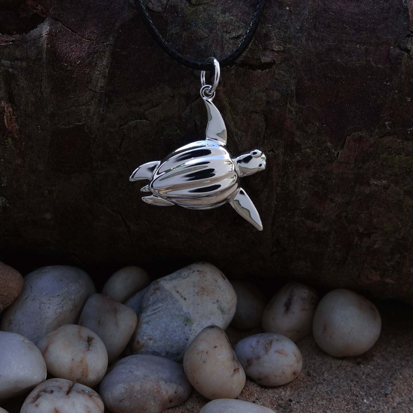 Sea Turtle necklace. Made from highly polished, tarnish resistant silver, strung on a strong cord. © Adrian Ashley
