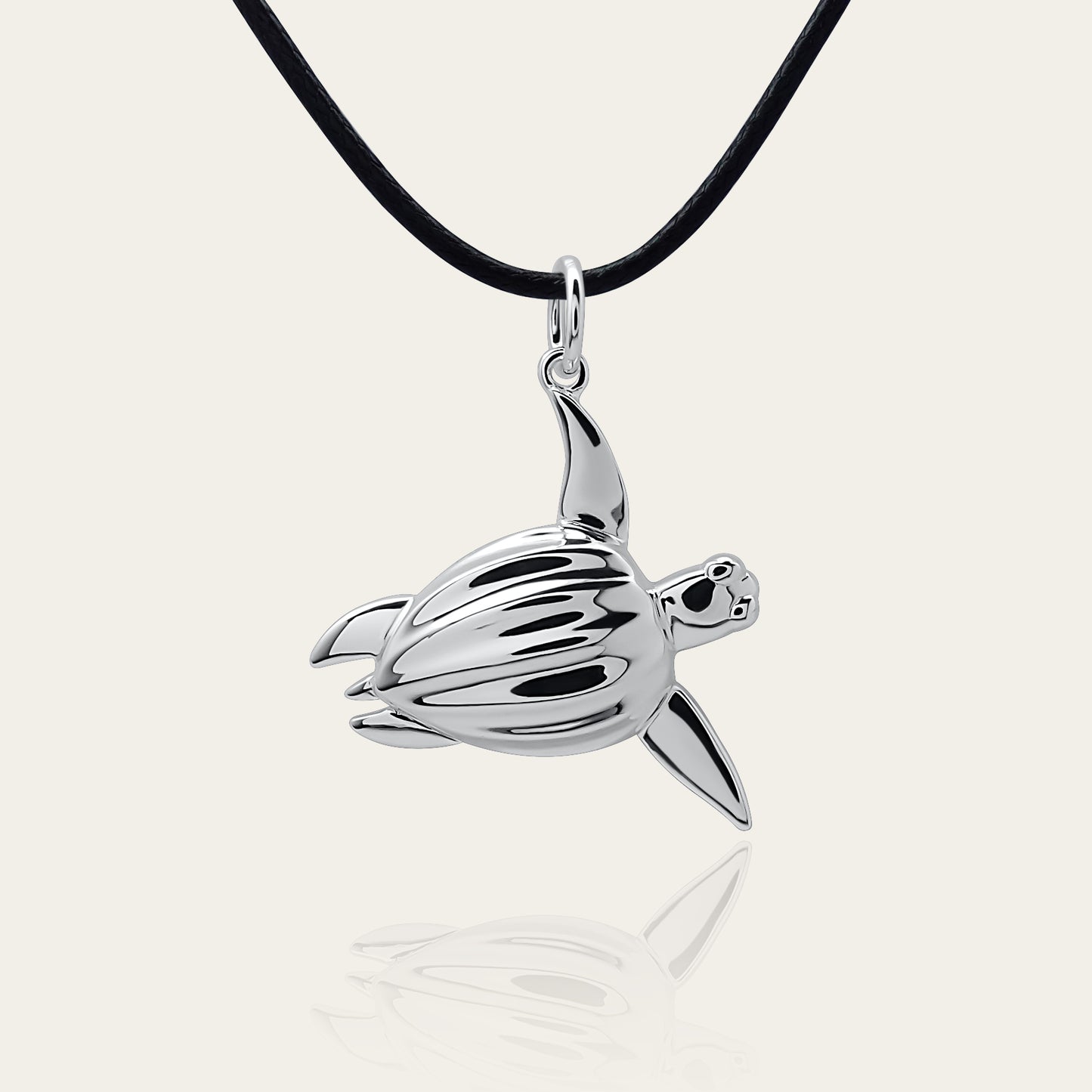 Sea Turtle necklace. Made from highly polished, tarnish resistant silver, strung on a strong cord. © Adrian Ashley
