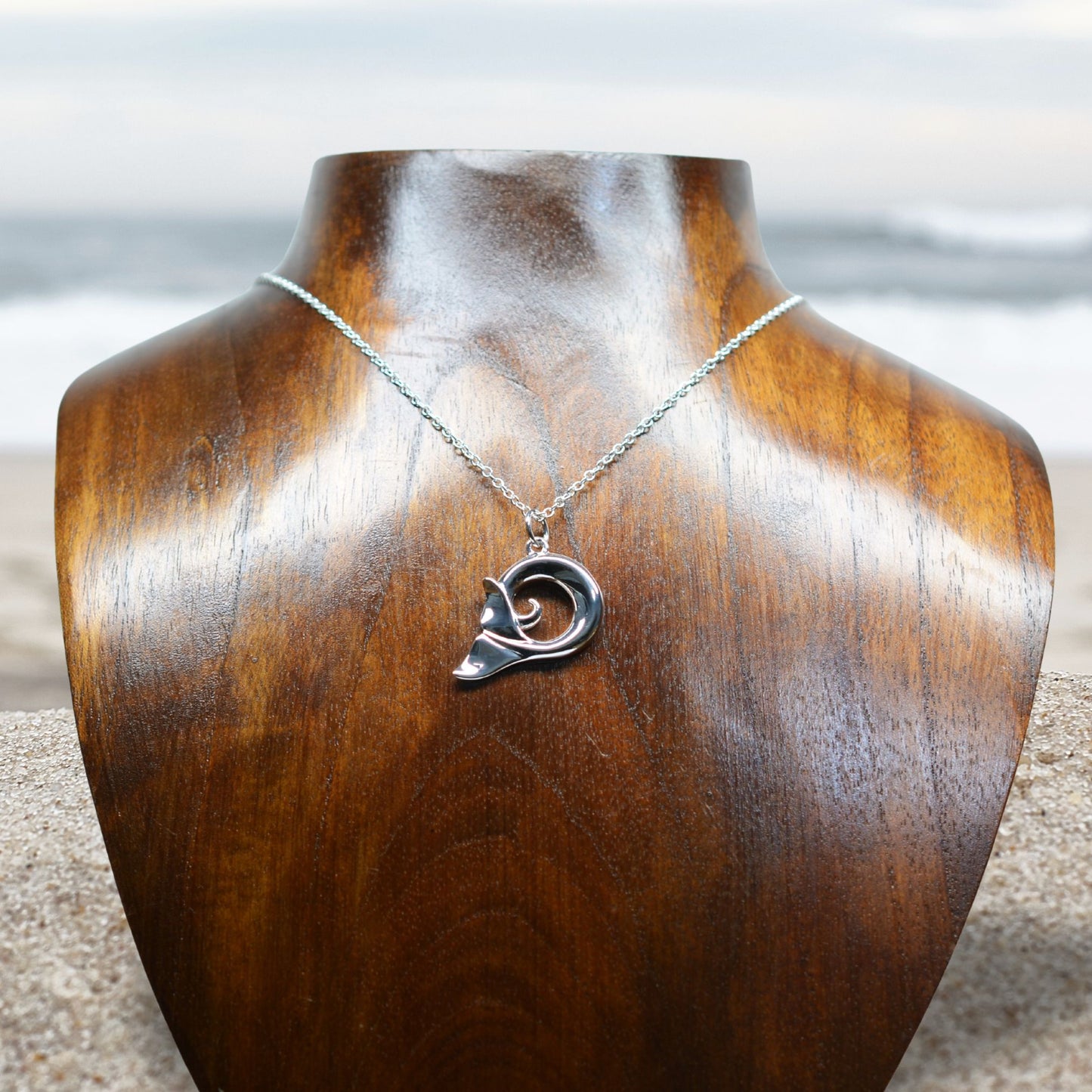 Whale spirit necklace. Made from highly polished, tarnish resistant silver, hung on a solid silver chain. © Adrian Ashley