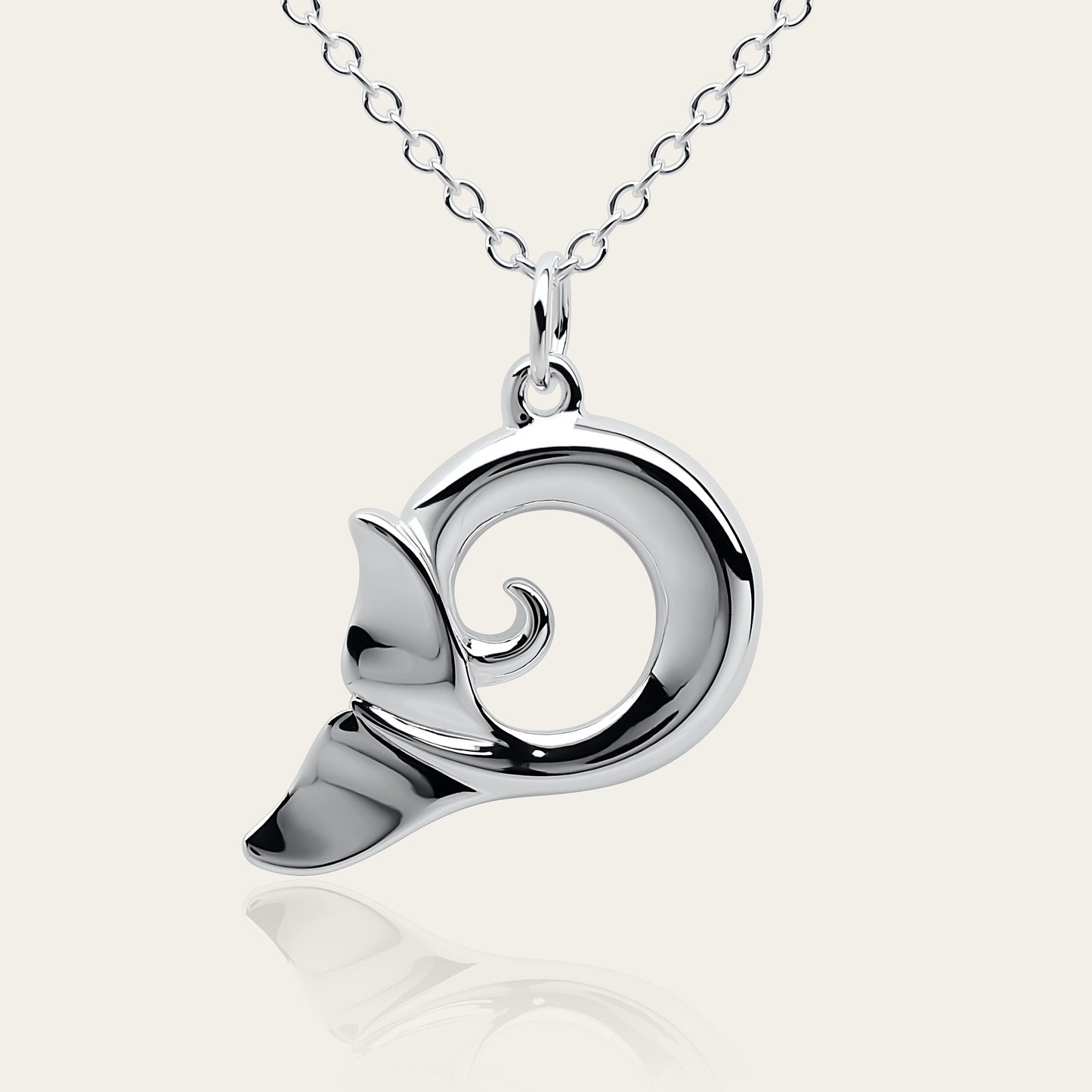 Whale spirit necklace. Made from highly polished, tarnish resistant silver, hung on a solid silver chain. © Adrian Ashley