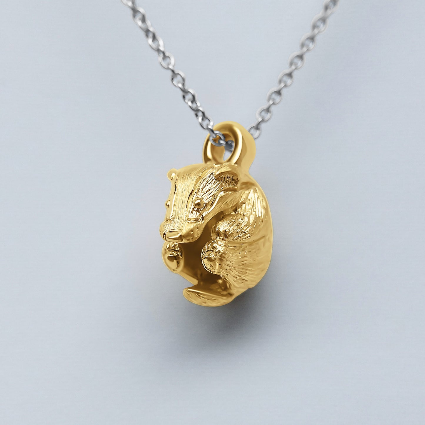 Solid 22ct gold badger pendant and platinum chain. Handmade to order. © Adrian Ashley