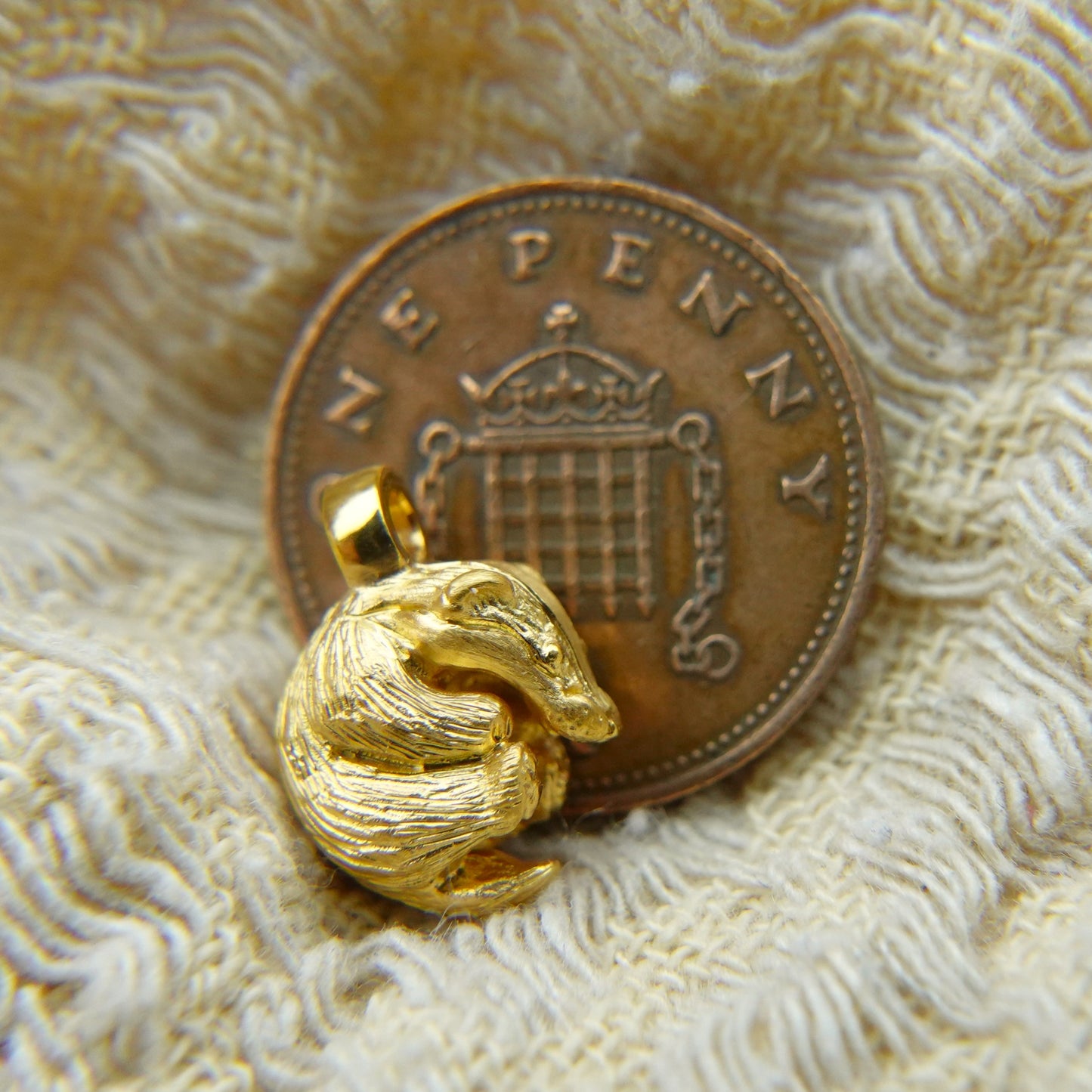 Solid 22ct gold badger pendant and platinum chain. Handmade to order. © Adrian Ashley