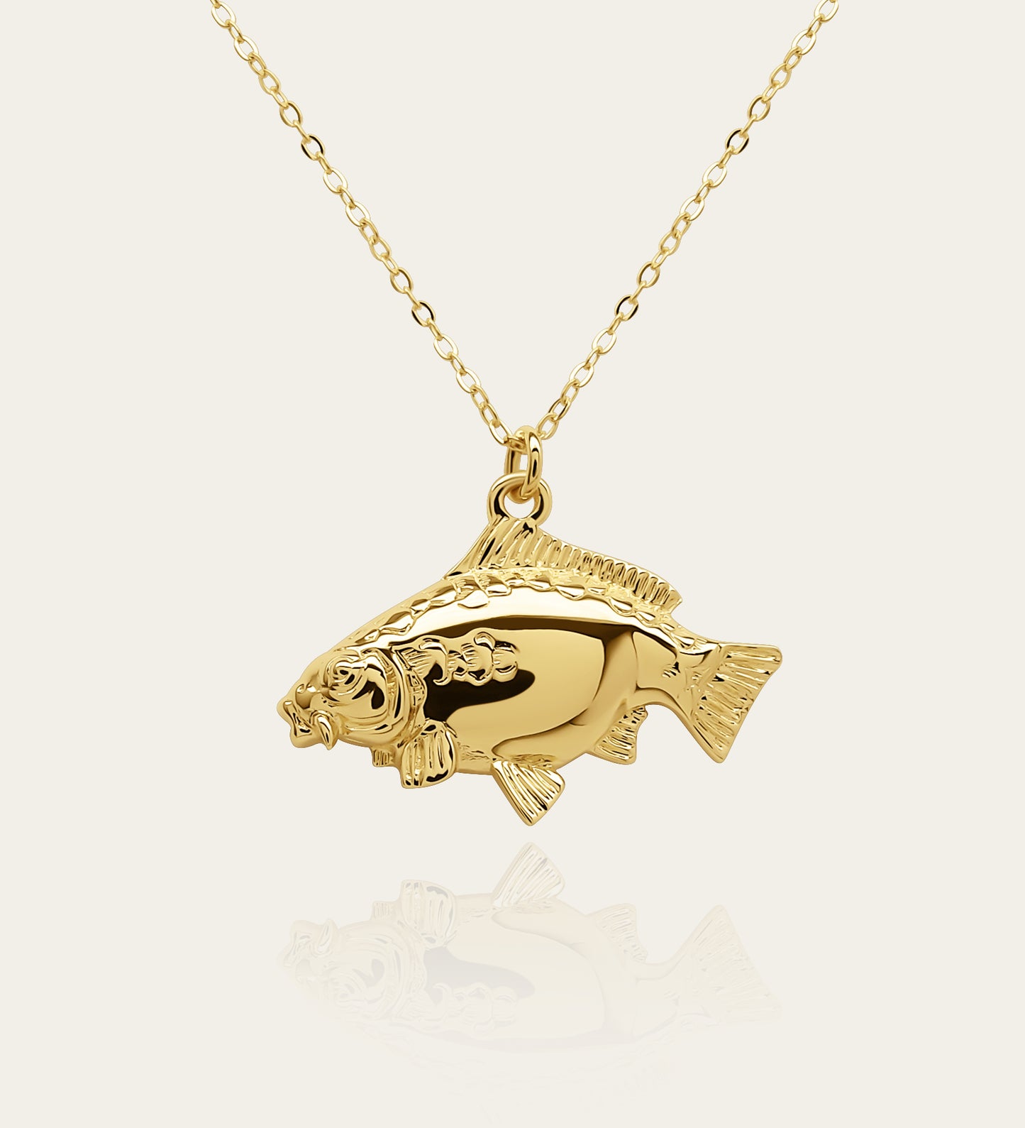 Gold plated silver Mirror Carp pendant and chain. © Adrian Ashley