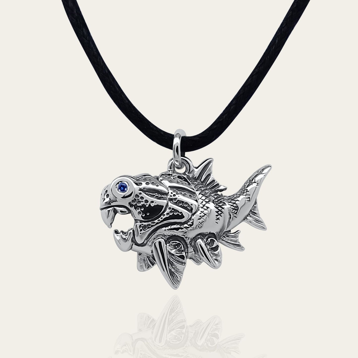 Dunkleosteus necklace. Made from sterling silver with an antiqued finish, set with a gemstone eye. Prehistoric fish pendant © Adrian Ashley