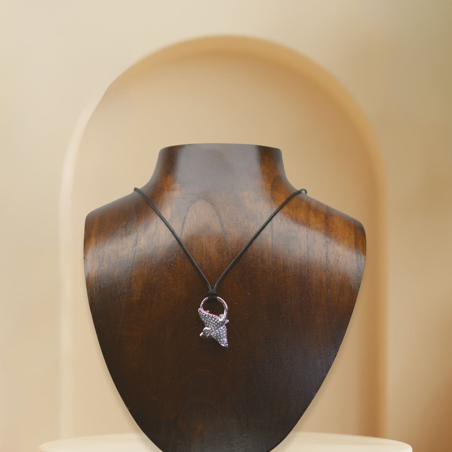 Eagle Ray necklace, Made from highly polished, tarnish resistant silver, double sided pendant, strung on a strong cord. © Adrian Ashley