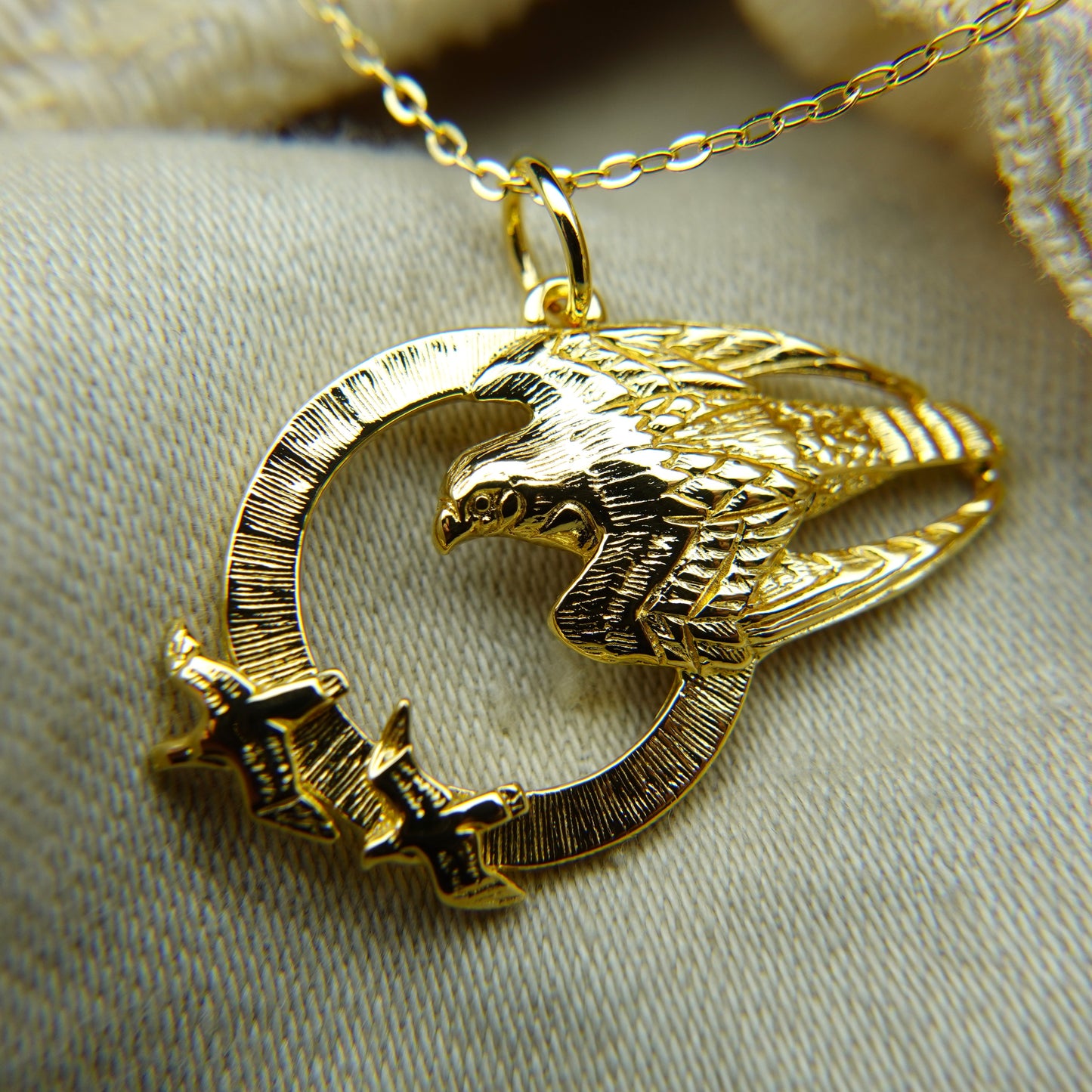 Gold plated silver falcon pendant & cord or chain © Adrian Ashley