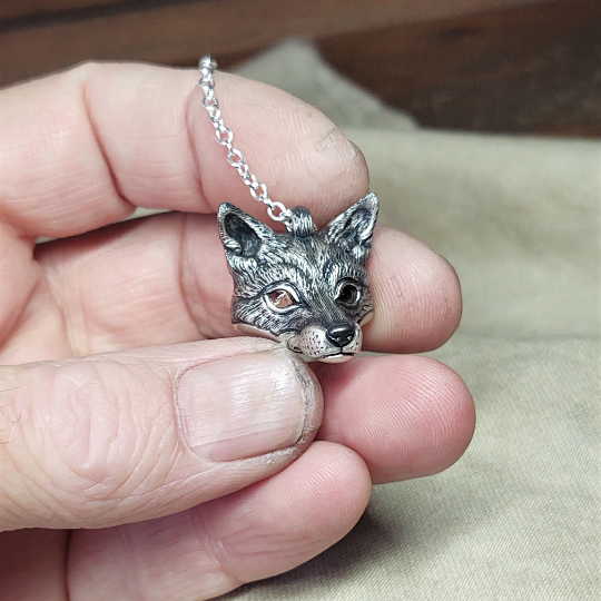 Small silver fox Necklace. Fox's head pendant in sterling silver with citrine eyes and a silver chain. © Adrian Ashley