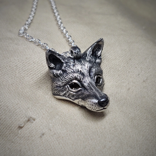 Small silver fox Necklace. Fox's head pendant in sterling silver with citrine eyes and a silver chain. © Adrian Ashley