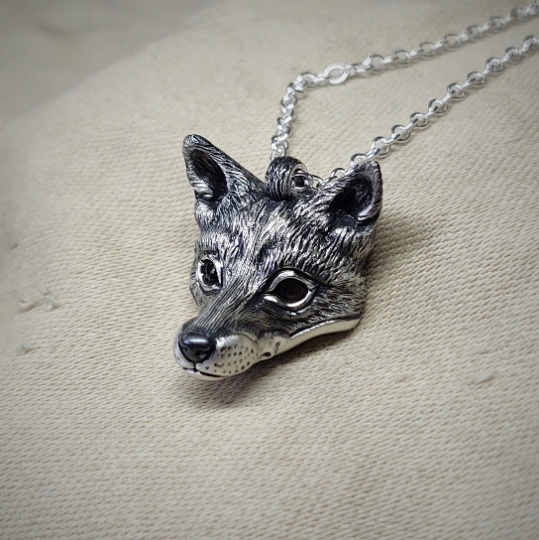 Small silver fox Necklace. Fox's head pendant in sterling silver with citrine eyes and a silver chain. © Adrian Ashley