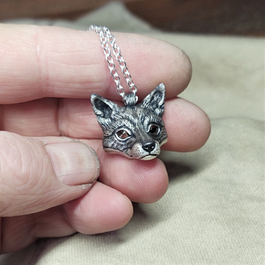 Small silver fox Necklace. Fox's head pendant in sterling silver with citrine eyes and a silver chain. © Adrian Ashley