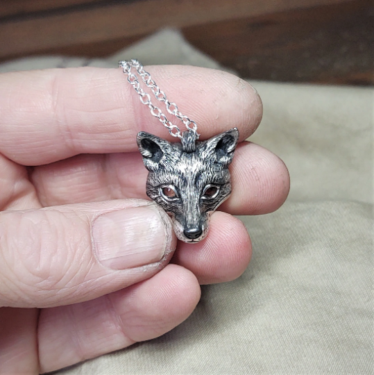Small silver fox Necklace. Fox's head pendant in sterling silver with citrine eyes and a silver chain. © Adrian Ashley