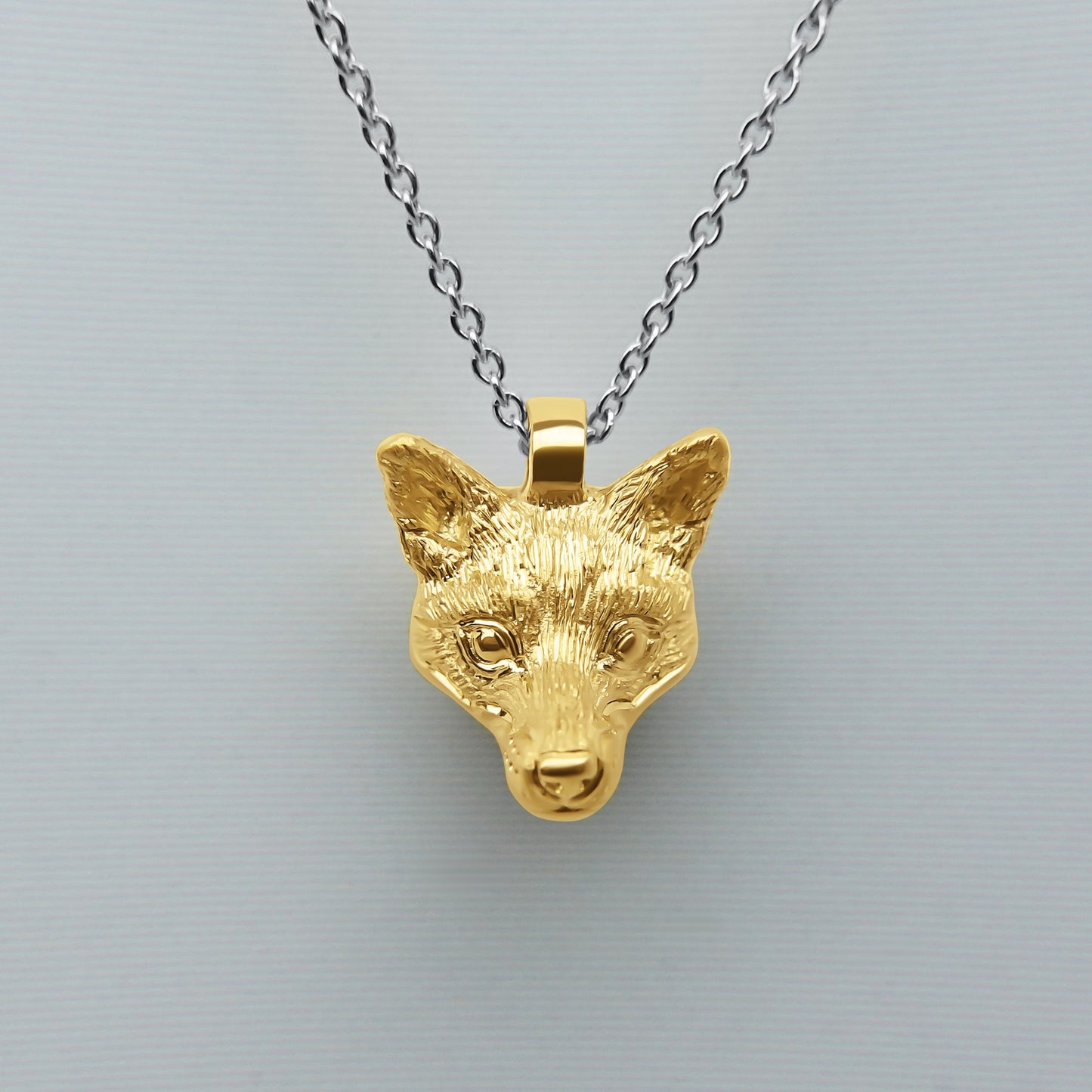 Solid 22ct gold fox pendant and platinum chain. Handmade to order. © Adrian Ashley