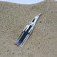 Freediving fin necklace. Made from highly polished, tarnish resistant silver, strung on a strong cord. © Adrian Ashley