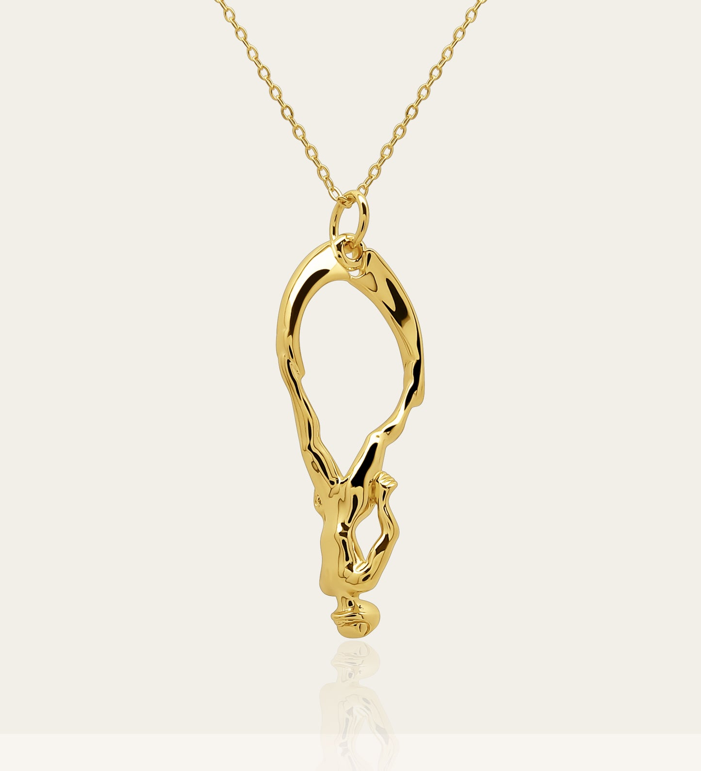 Gold plated silver Freediver pendant and chain. © Adrian Ashley