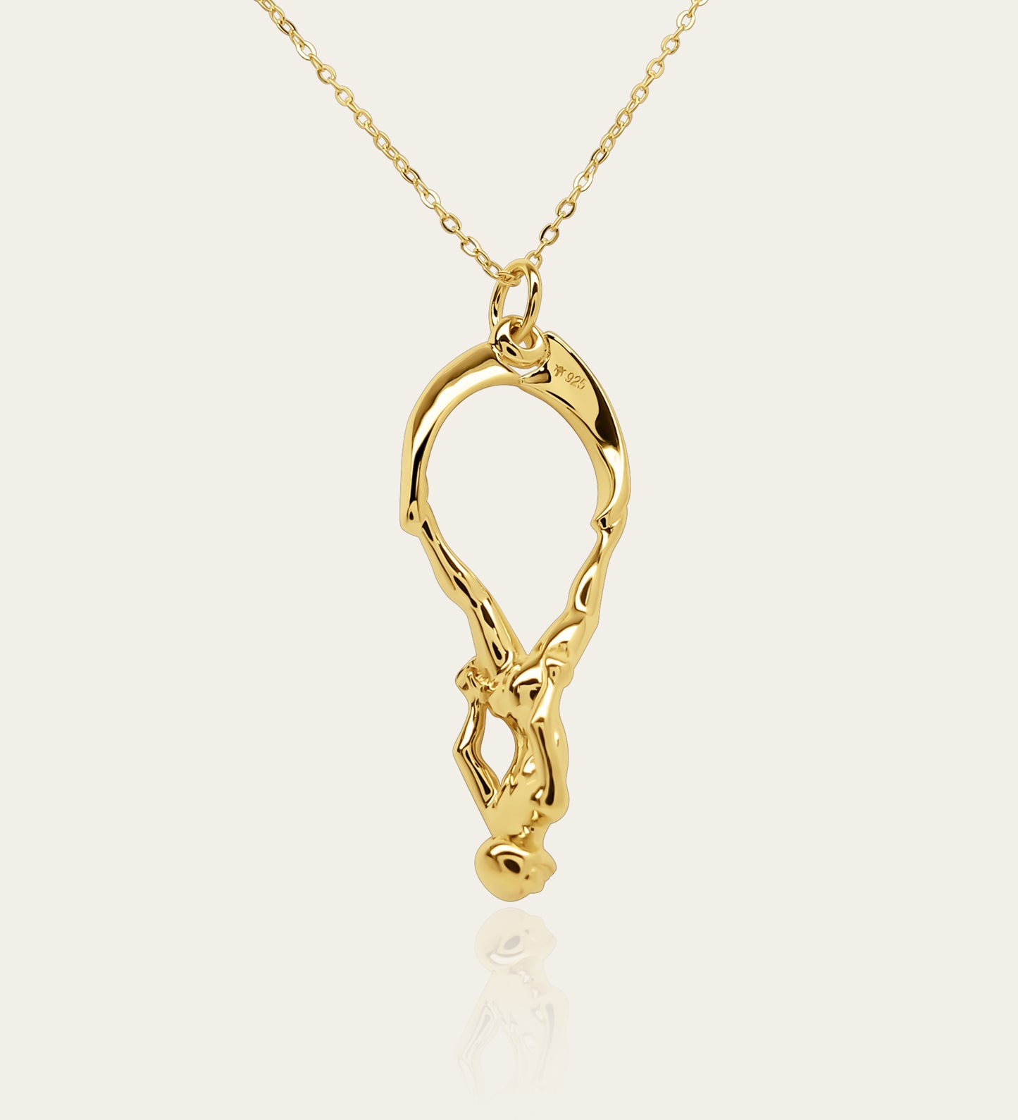 Gold plated silver Freediver pendant and chain. © Adrian Ashley