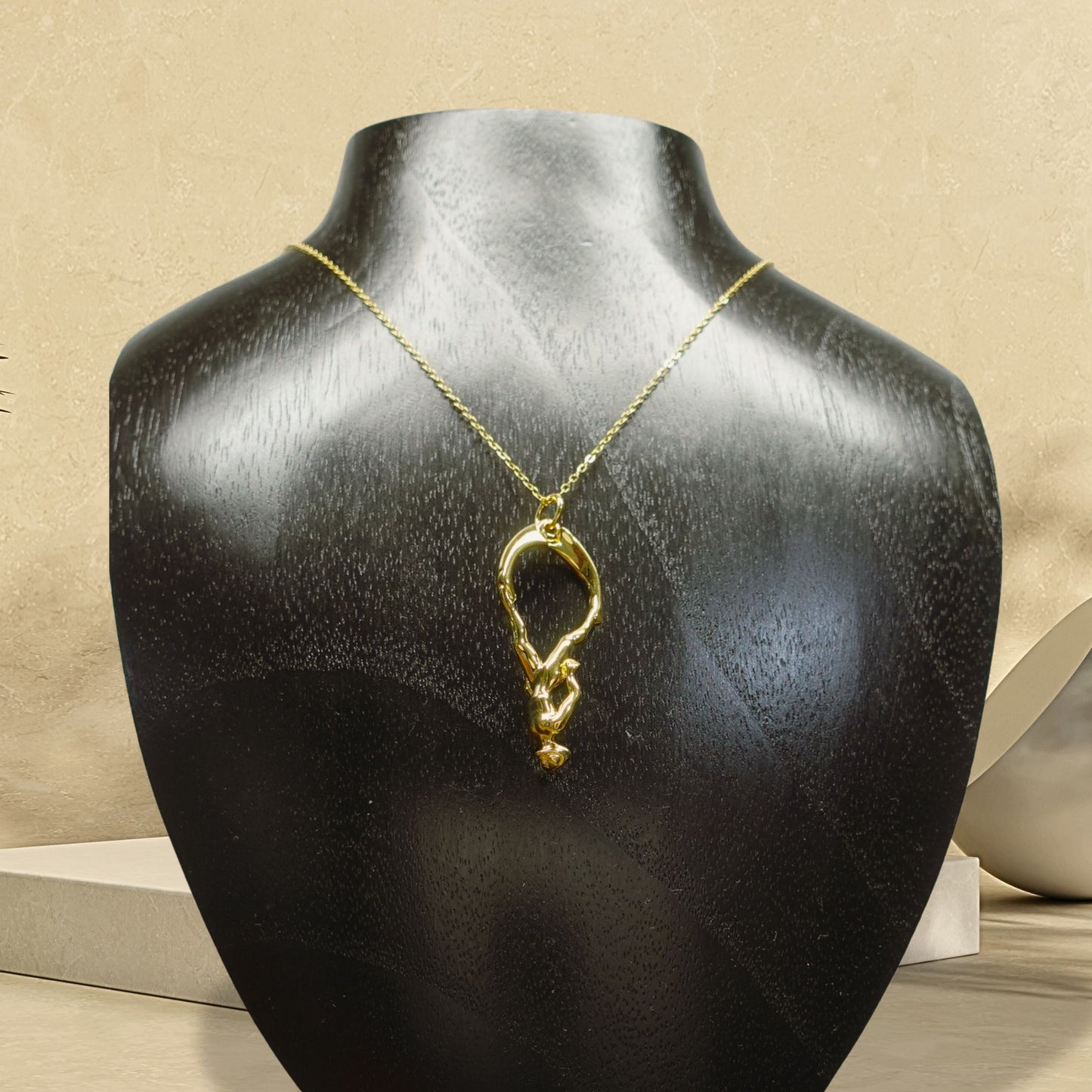 Gold plated silver Freediver pendant and chain. © Adrian Ashley