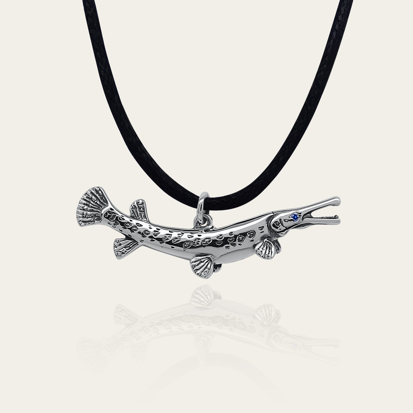 Gar pike necklace. Made from sterling silver with an antiqued finish, set with a gemstone eye. Alligator gar. Ideal fisherman’s angling gift © Adrian Ashley
