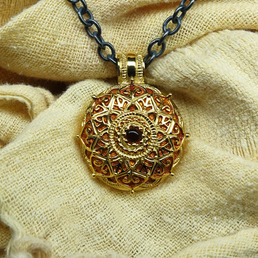 Gold mandala necklace. Solid gold meditation, yoga or mindfulness amulet on a blackened silver chain. *This piece is finished and ready to be shipped* © Adrian Ashley