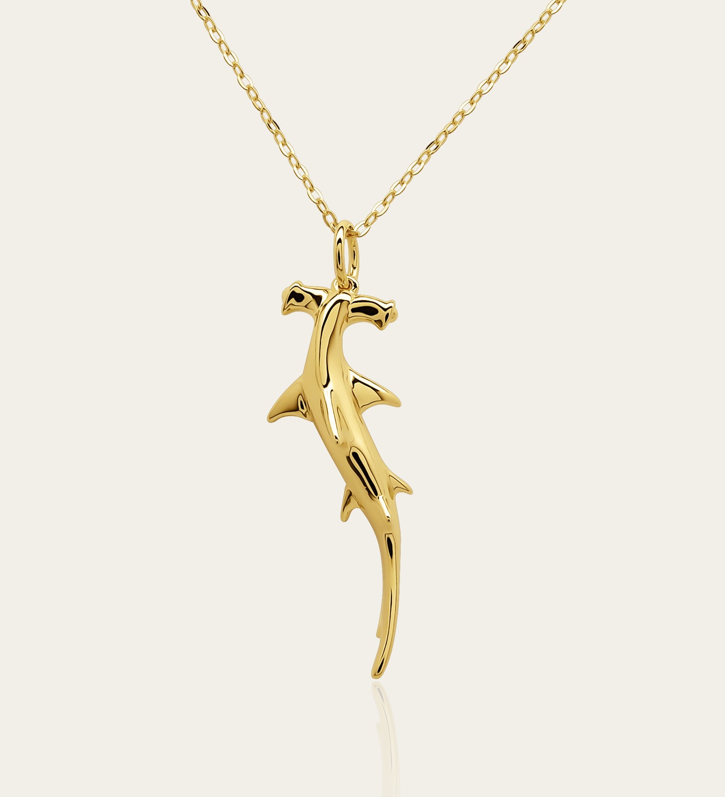 Gold plated silver Hammerhead Shark pendant and chain. © Adrian Ashley