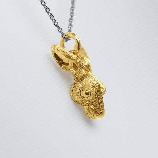 Solid 22ct gold hare pendant and platinum chain.