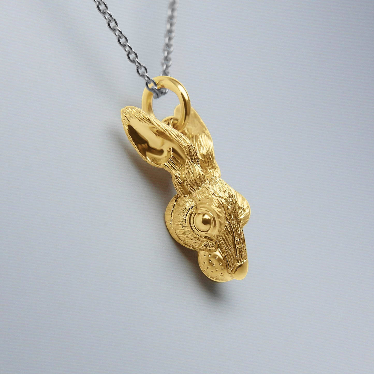 Solid 22ct gold hare pendant and platinum chain. Handmade to order. © Adrian Ashley