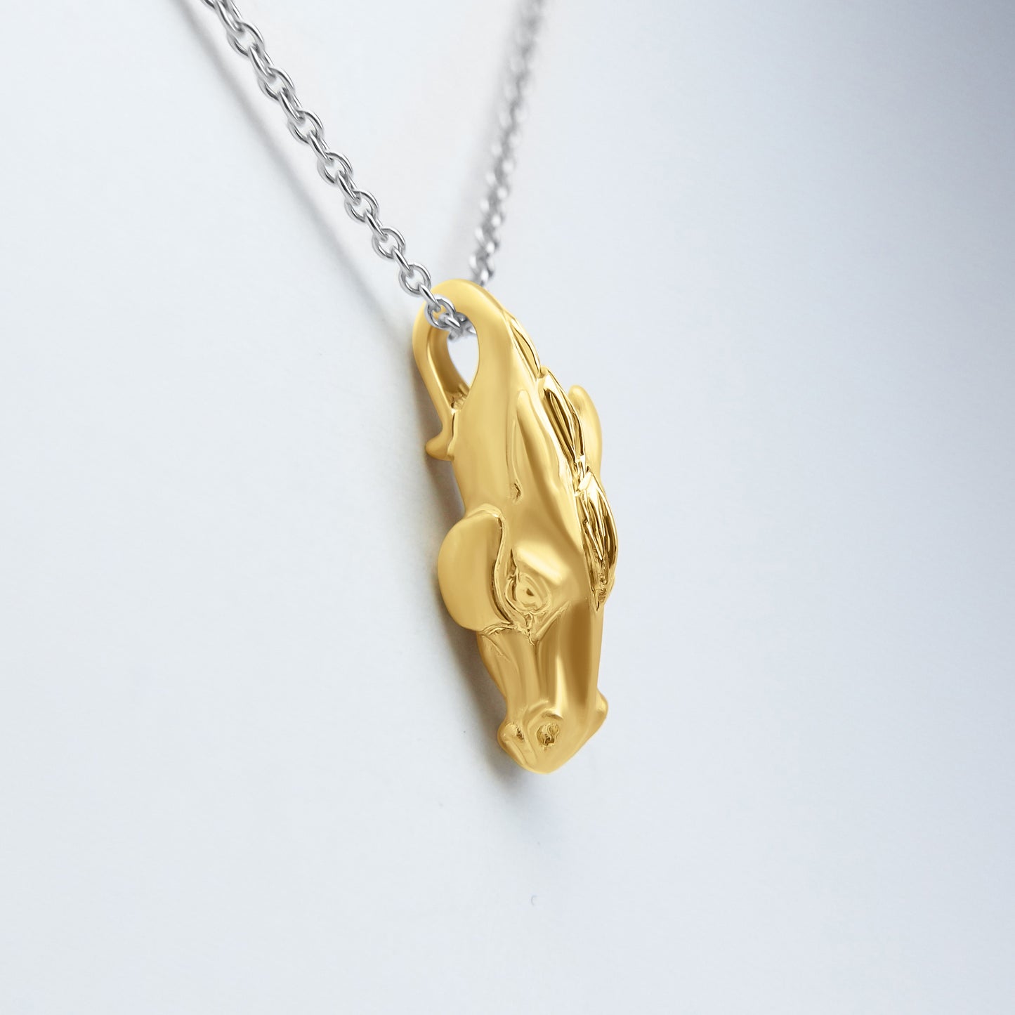 Solid 22ct gold horse pendant and platinum chain. Handmade to order. © Adrian Ashley