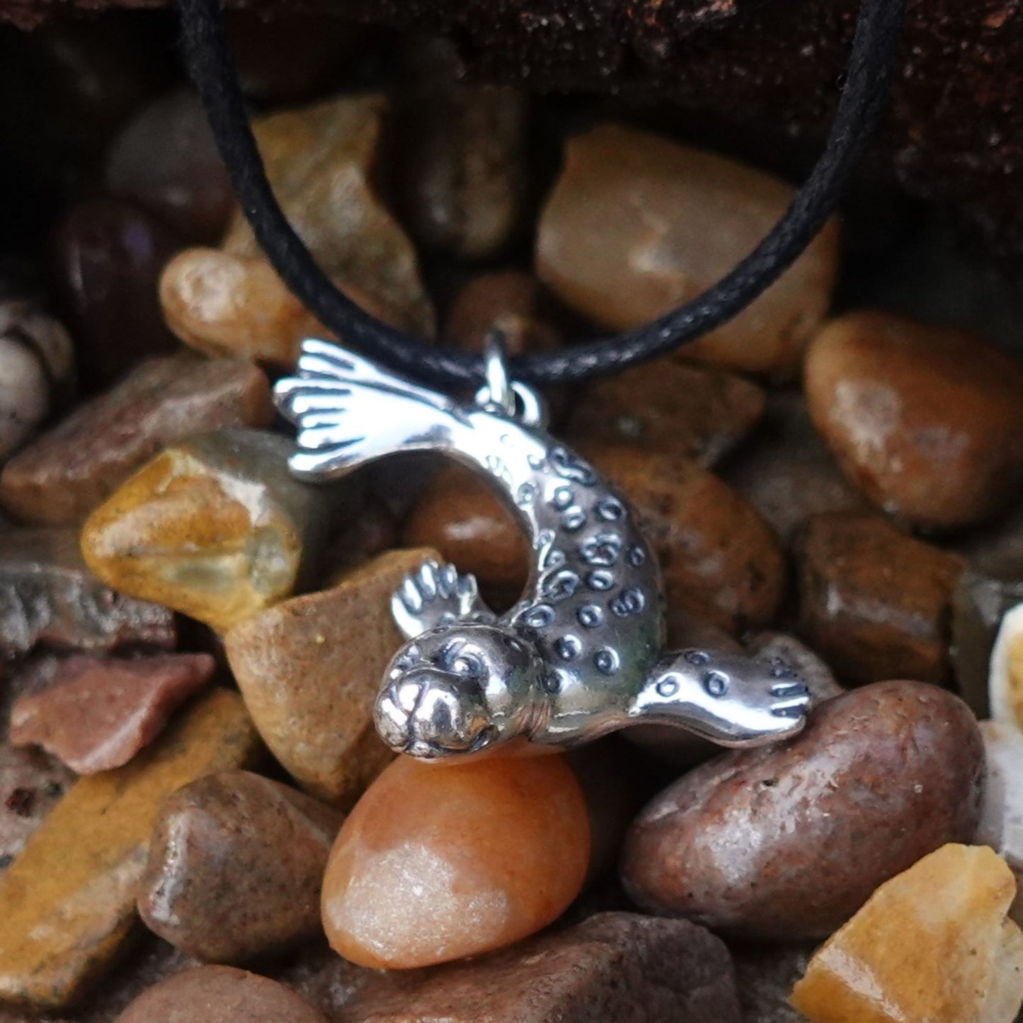 Seal necklace. Made from sterling silver with an antiqued finish. © Adrian Ashley