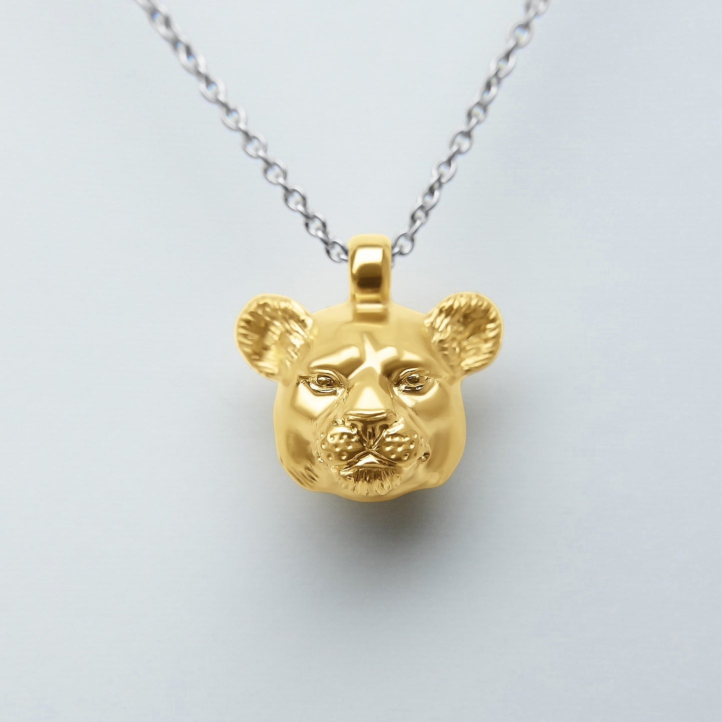 Solid 22ct gold lioness pendant and platinum chain. Handmade to order. © Adrian Ashley