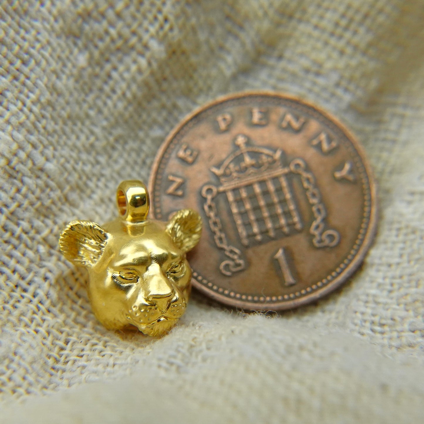 Solid 22ct gold lioness pendant and platinum chain. Handmade to order. © Adrian Ashley