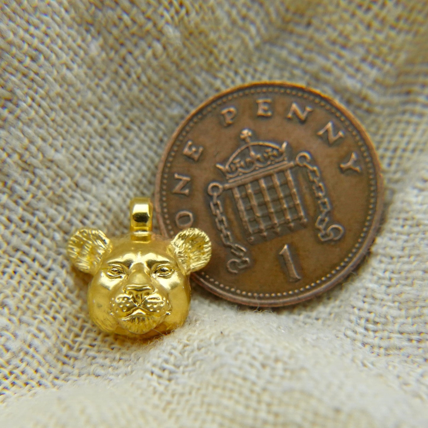 Solid 22ct gold lioness pendant and platinum chain. Handmade to order. © Adrian Ashley