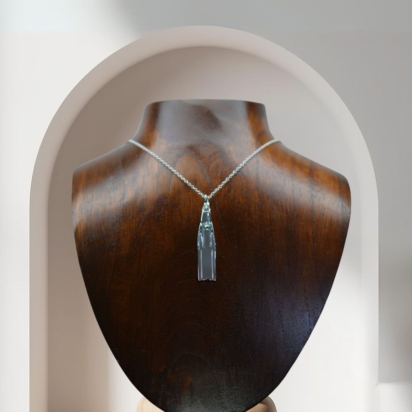 Freediving fin necklace. Made from highly polished, tarnish resistant silver, hung on a solid silver chain. © Adrian Ashley