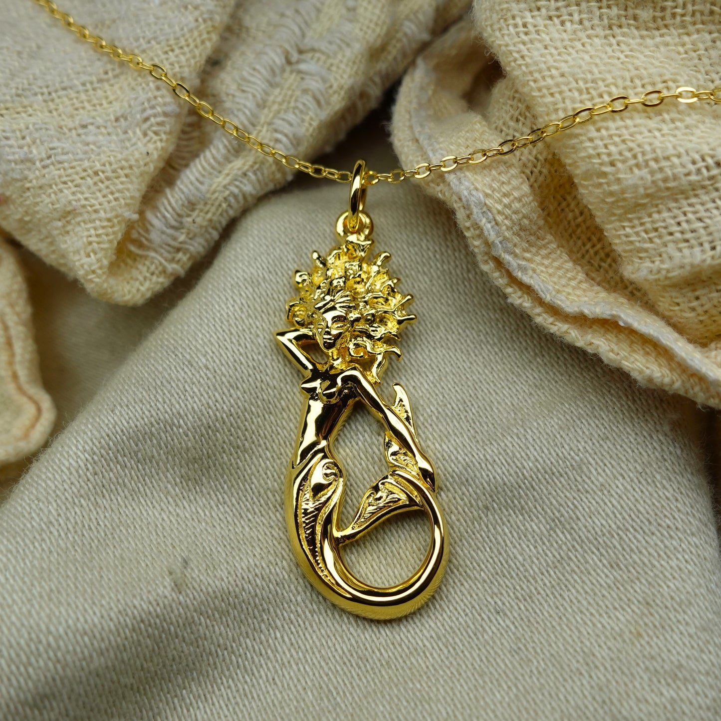 Gold plated silver Mermaid pendant and chain. © Adrian Ashley