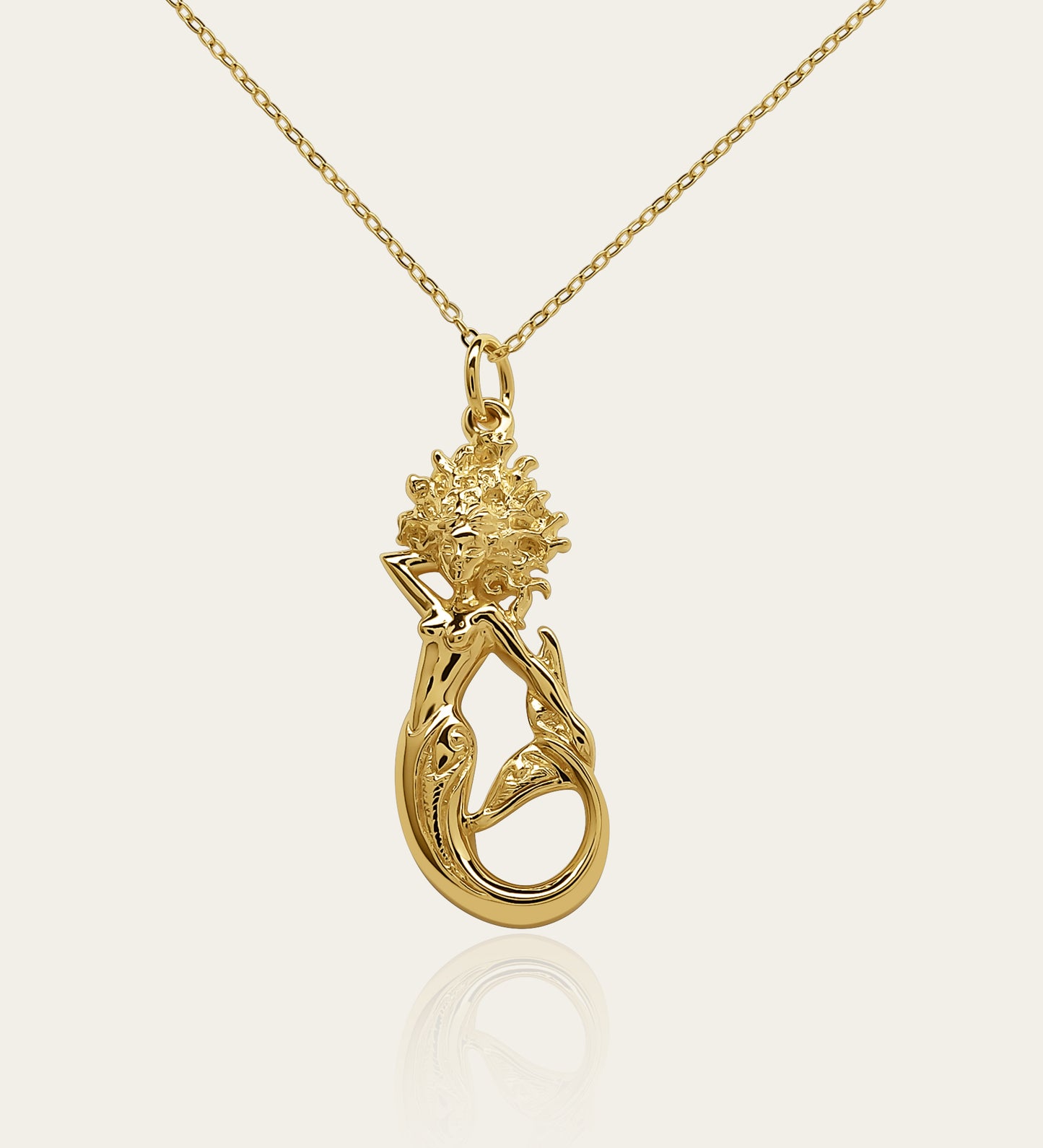 Gold plated silver Mermaid pendant and chain. © Adrian Ashley