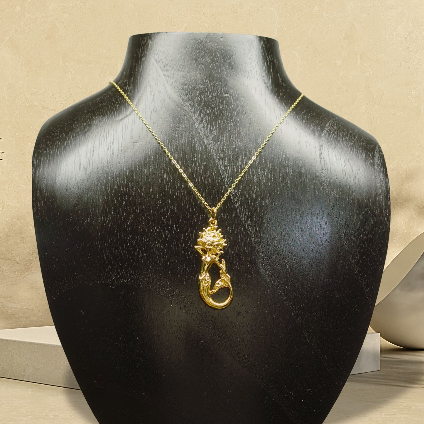 Gold plated silver Mermaid pendant and chain. © Adrian Ashley