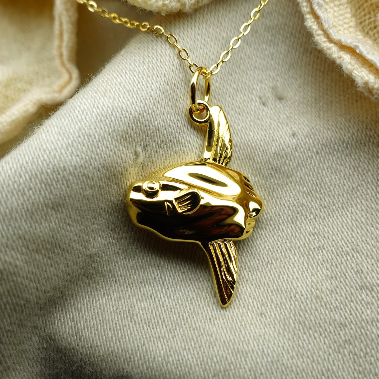 Gold plated silver Mola mola, Ocean sunfish or Moonfish pendant and chain © Adrian Ashley