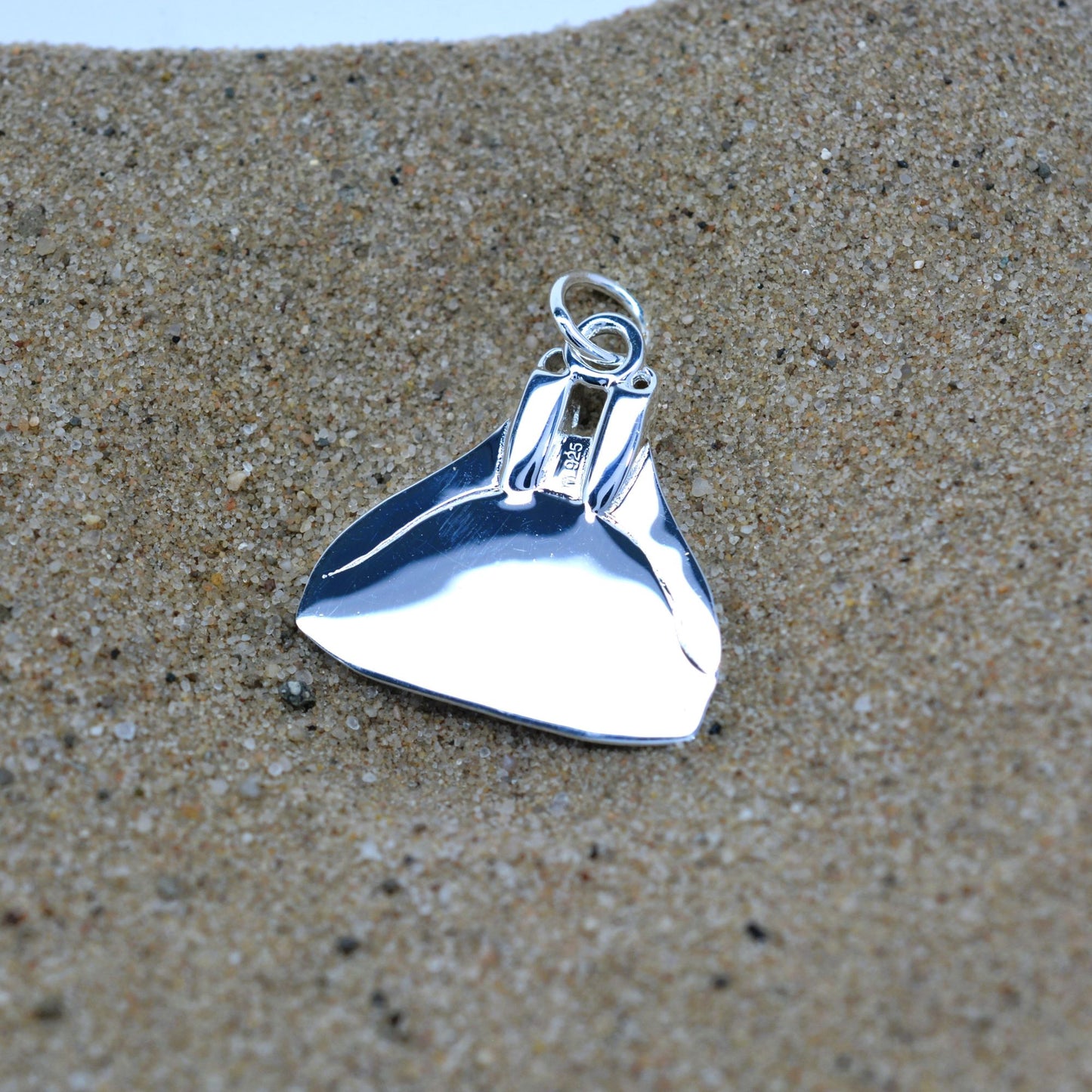 Freediving monofin or monoplame necklace. Made from highly polished, tarnish resistant silver, hung on a silver chain. © Adrian Ashley