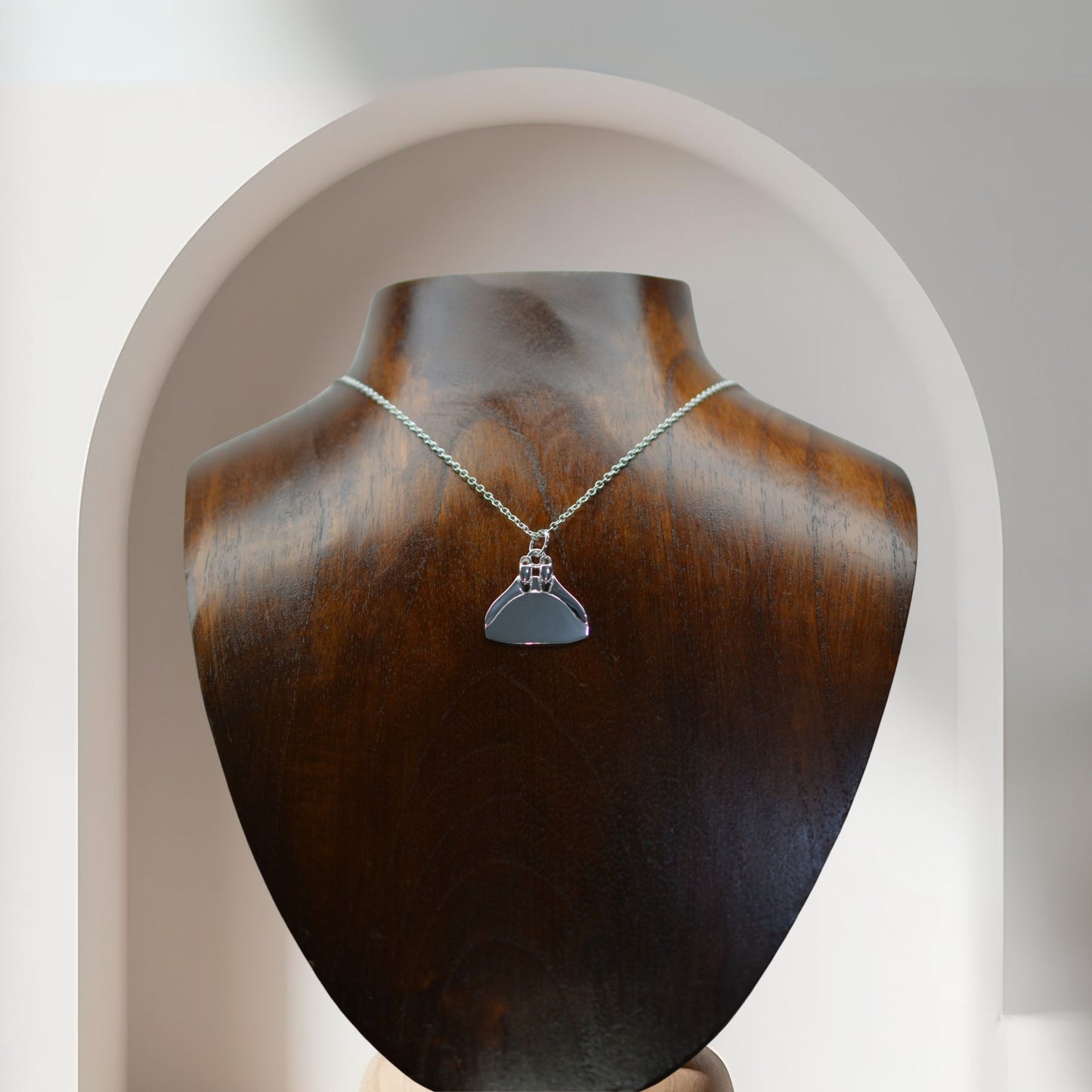 Freediving monofin or monoplame necklace. Made from highly polished, tarnish resistant silver, hung on a silver chain. © Adrian Ashley